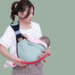 YARAN EMPORIUM cotton baby sling wrap in green worn by woman holding sleeping baby