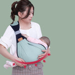 YARAN EMPORIUM cotton baby sling wrap in green worn by woman holding sleeping baby