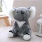 Soft gray and white koala plush toy for kids sitting on a beige chair near a white lantern