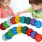 Colorful math fidget spinner for kids with multiplication and addition facts displayed on each side